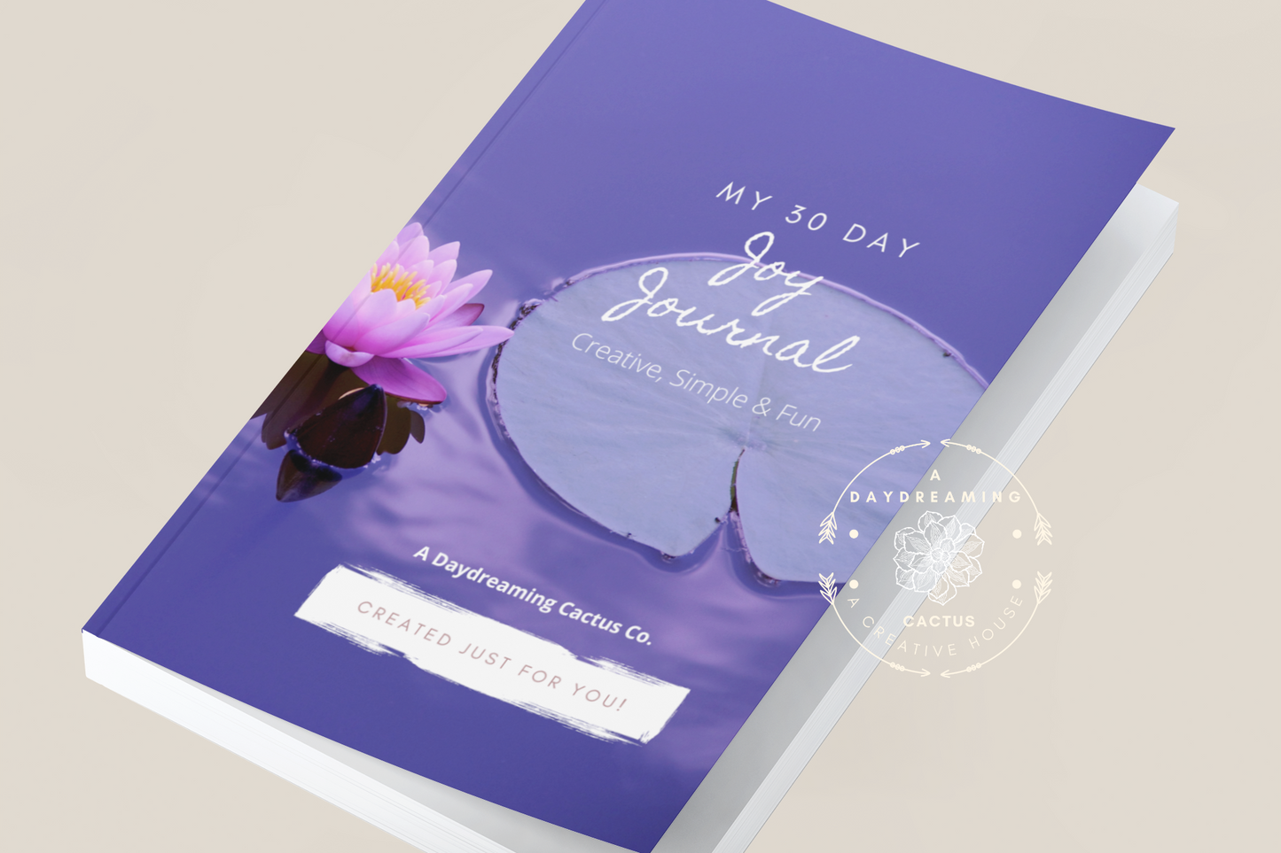 Mockup of A Daydreaming Cactus journal creation. This is the 30 Day Joy Journal with a blue peuple lily pad cover.  