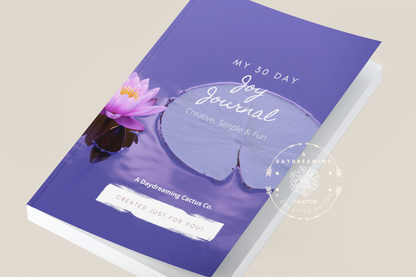 Mockup of A Daydreaming Cactus journal creation. This is the 30 Day Joy Journal with a blue peuple lily pad cover.  