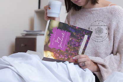 Mockup of A Daydreaming Cactus journal creation. This is the 30 Day Joy Journal with a lavender flowers cover and woman with a cup of coffee.