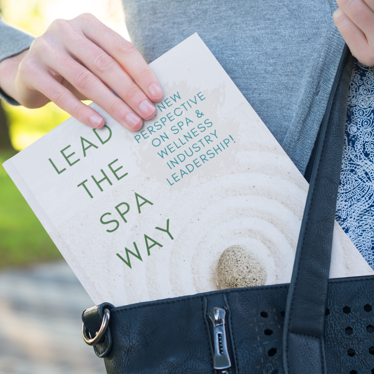 Solo Spa Pros Lead The Spa Way Book in woman's purse Mockup 01
